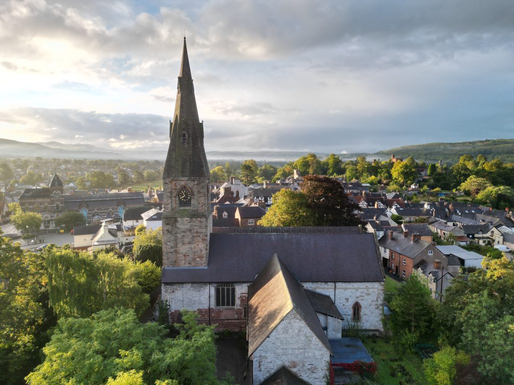 An aerial view of St Peter's church, Ruthin on a sunny day
